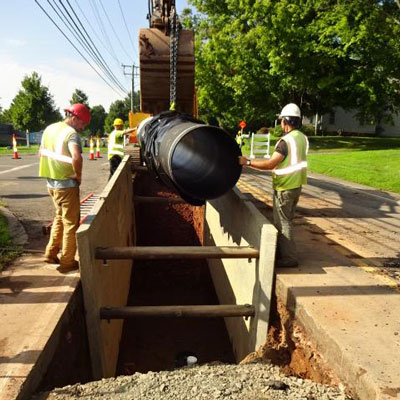 Crews install Ductile iron pipe for a water transmission main in Connecticut.