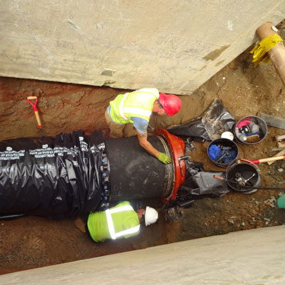Crews install Ductile iron pipe for a water transmission main in Connecticut.