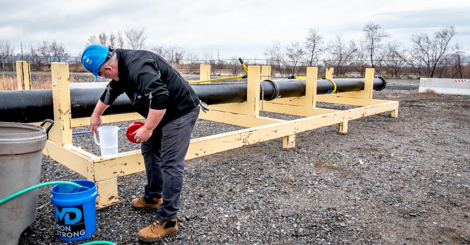 Jerry Regula conducts a hydrostatic test on ductile iron pipe