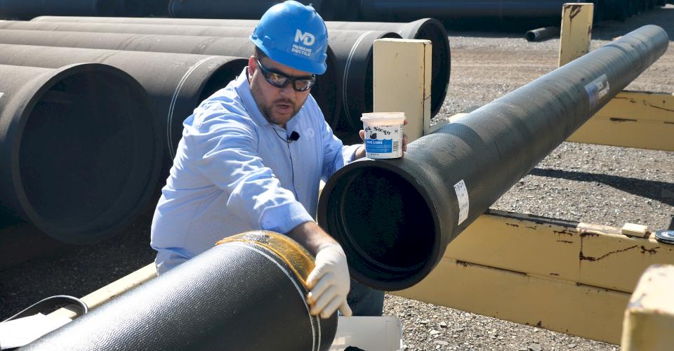 Lubing the pipe.