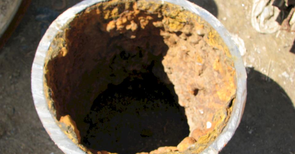 Tuberculation inside a pipe.