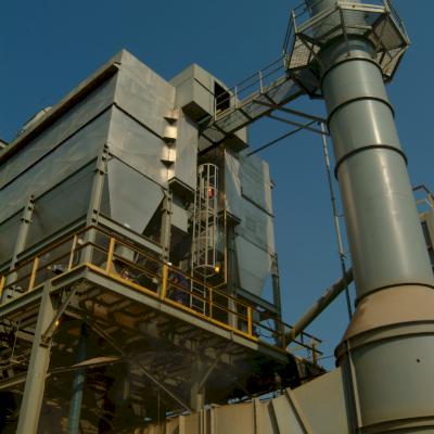 A baghouse removes the mercury containing activated carbon and particulates at a greater than 99.9% efficiency for filterable particles 2.5 microns and larger.