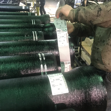 Serialized production stickers being applied to Ductile iron pipes in the finishing process.